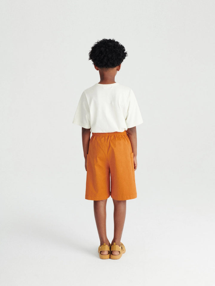 Garçon avec Shorts pour enfant True Artist en coton orange avec poches