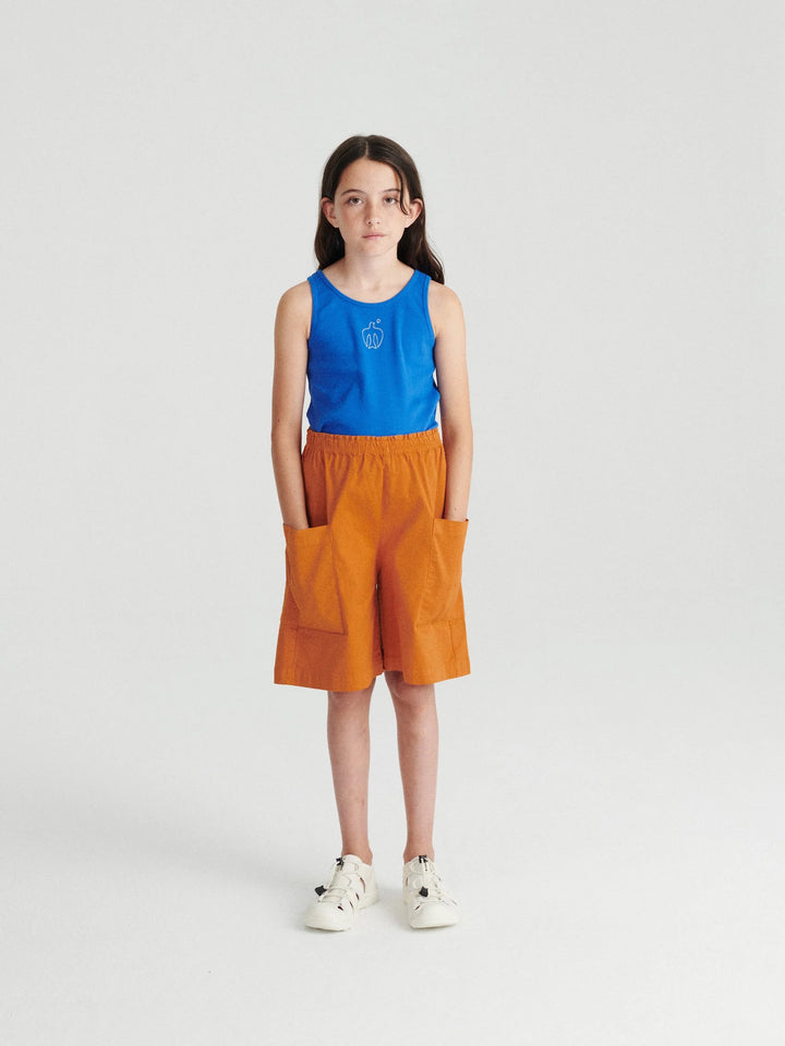 Fille avec Shorts pour enfant True Artist en coton orange avec poches et top bleu
