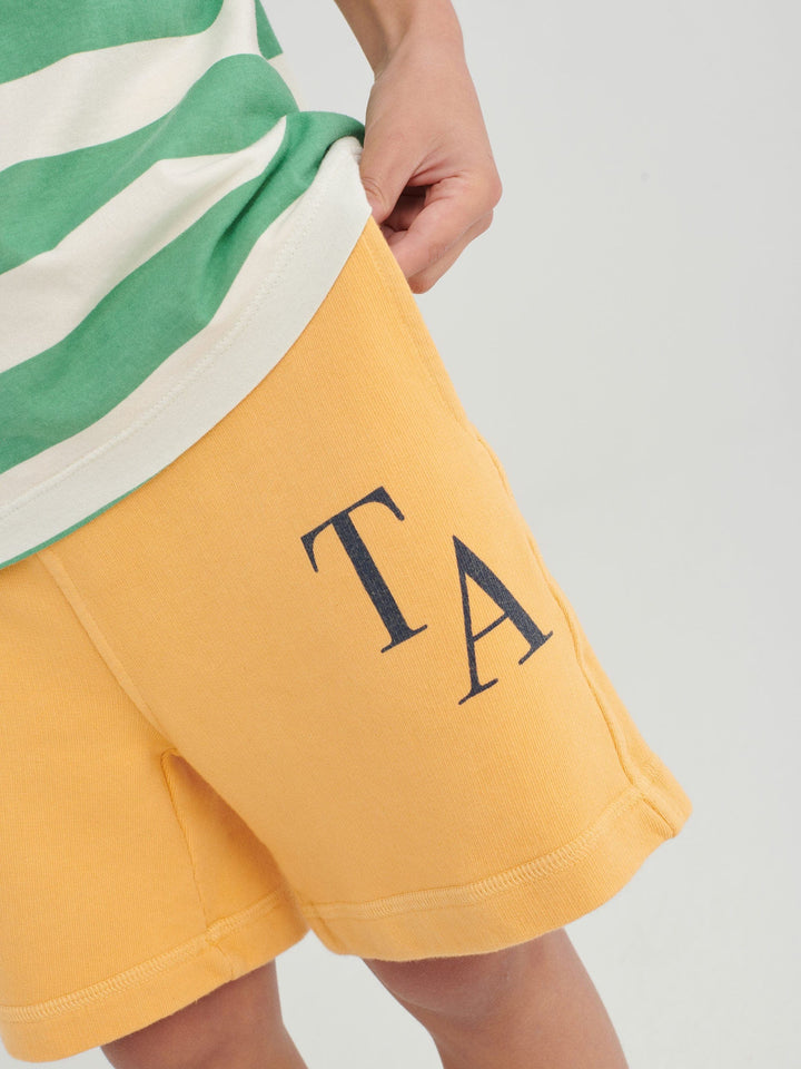 Shorts True Artist en coton jaune avec Logo TA