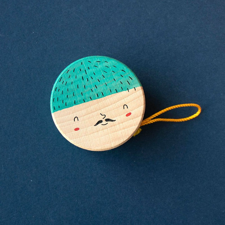 Yoyo en bois avec illustration de visage