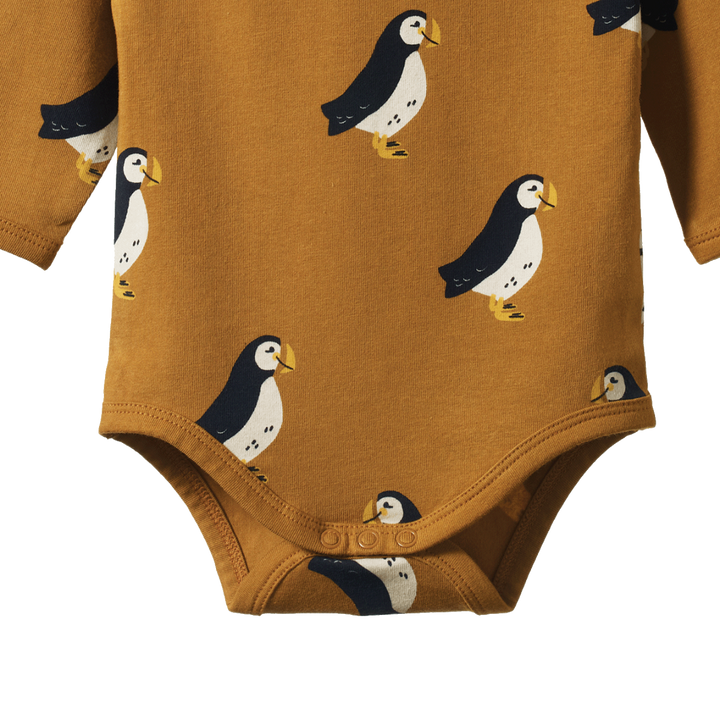 Détail de Body manches longues en coton caramel avec imprimé macareux