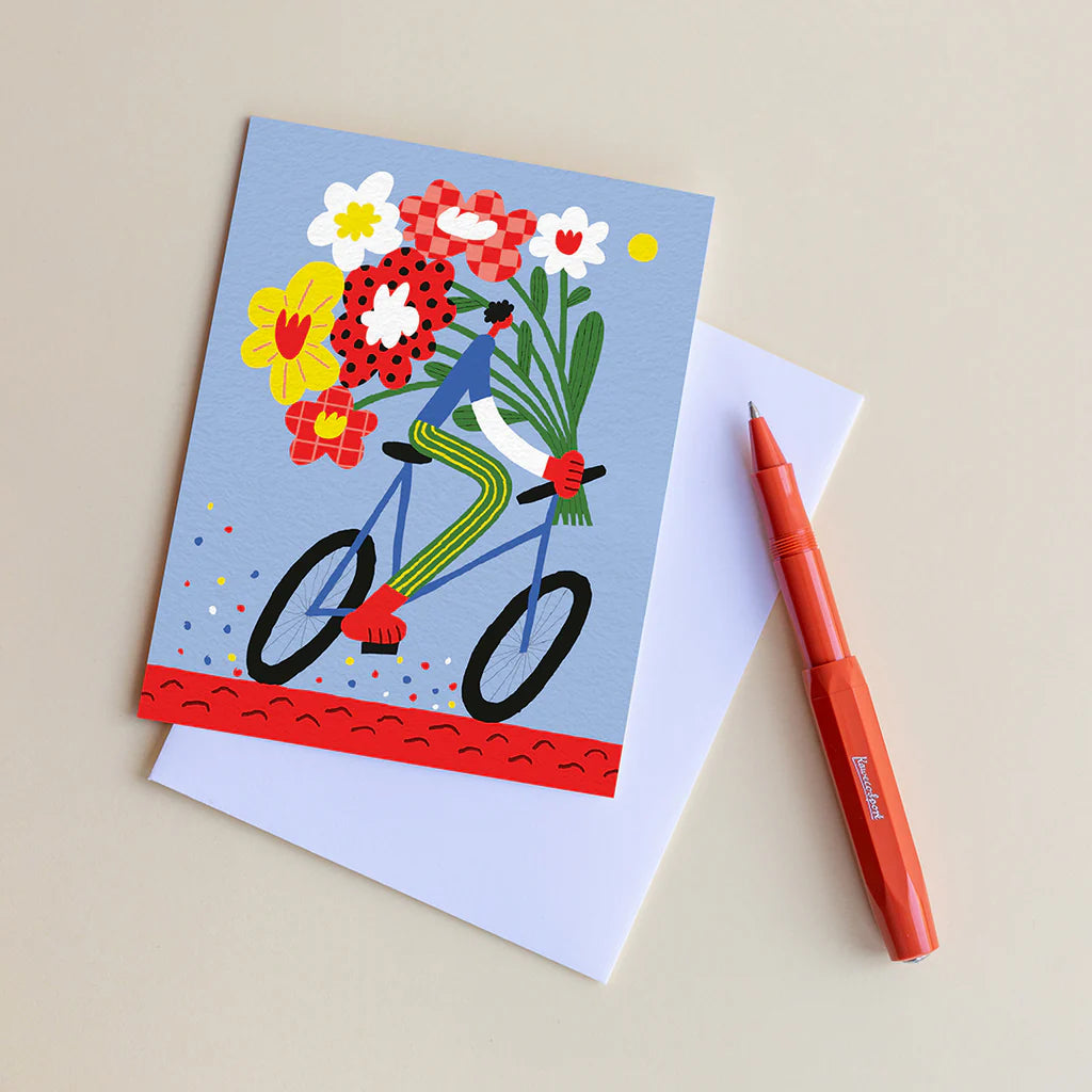 Carte de souhaits avec illustration de cycliste avec des fleurs 