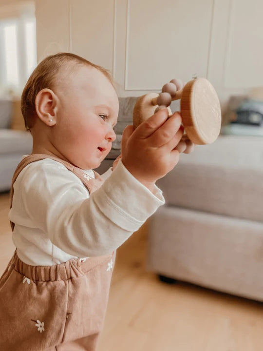 Bébé avec Clochette en bois