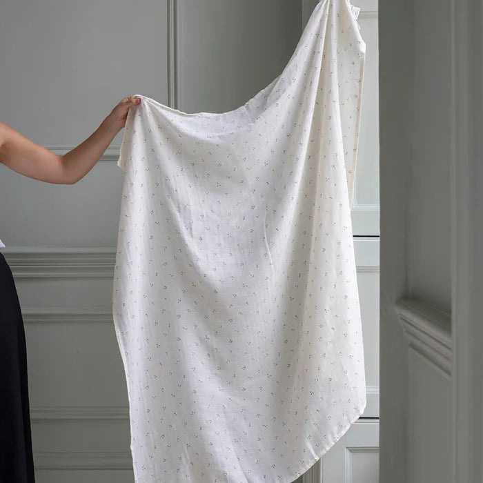 Couverture d'emmaillotage en coton blanc avec imprimé feuilles 