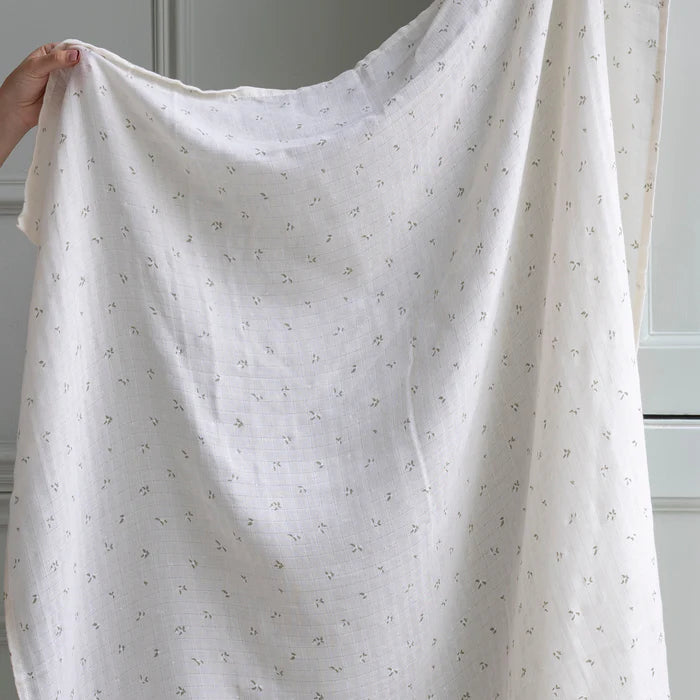 Couverture d'emmaillotage en coton blanc avec imprimé feuilles 