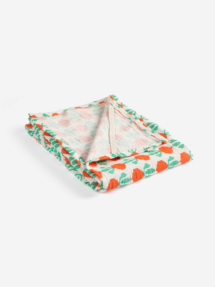Couverture d'emmaillotage en mousseline Bobo Choses imprimé radis oranges