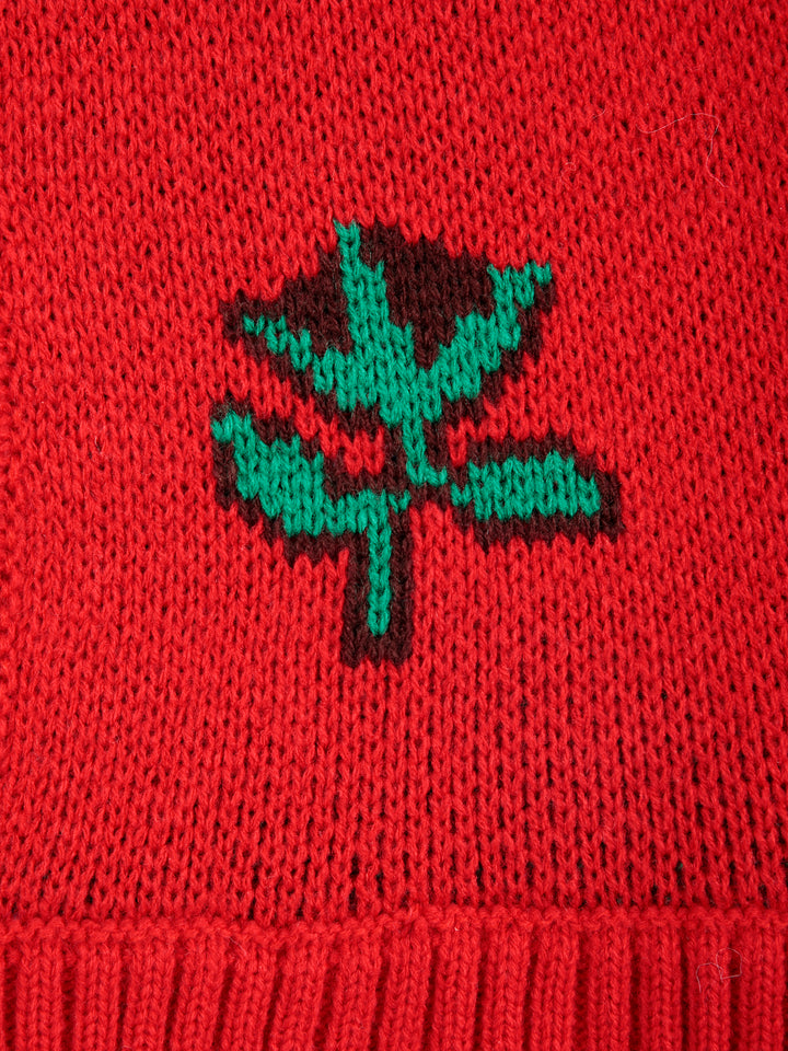 Détail de Balaclava Bobo Choses tricotée en acrylique rouge avec fleur verte