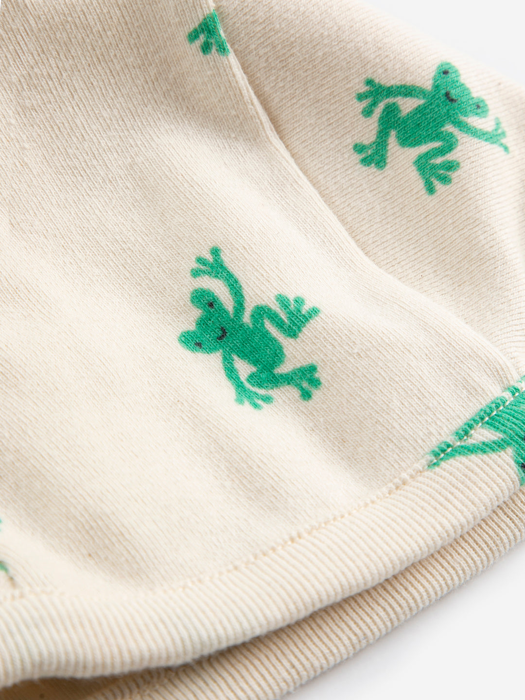 Détail de Bonnet Bobo Choses en coton écru imprimé grenouilles 