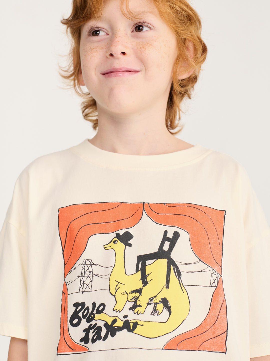 Enfant avec T-shirt Bobo Choses en coton blanc avec imprimé taxi dinosaure