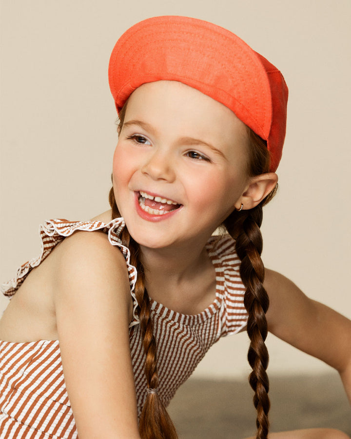 Fille avec Casquette en lin Caribou pamplemousse 
