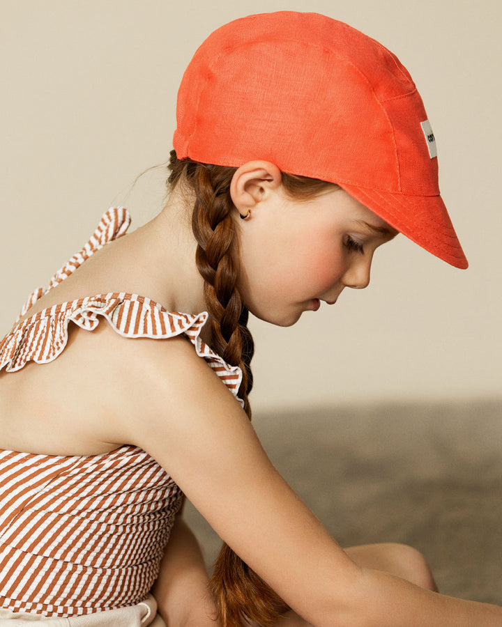 Fille avec Casquette en lin Caribou pamplemousse 
