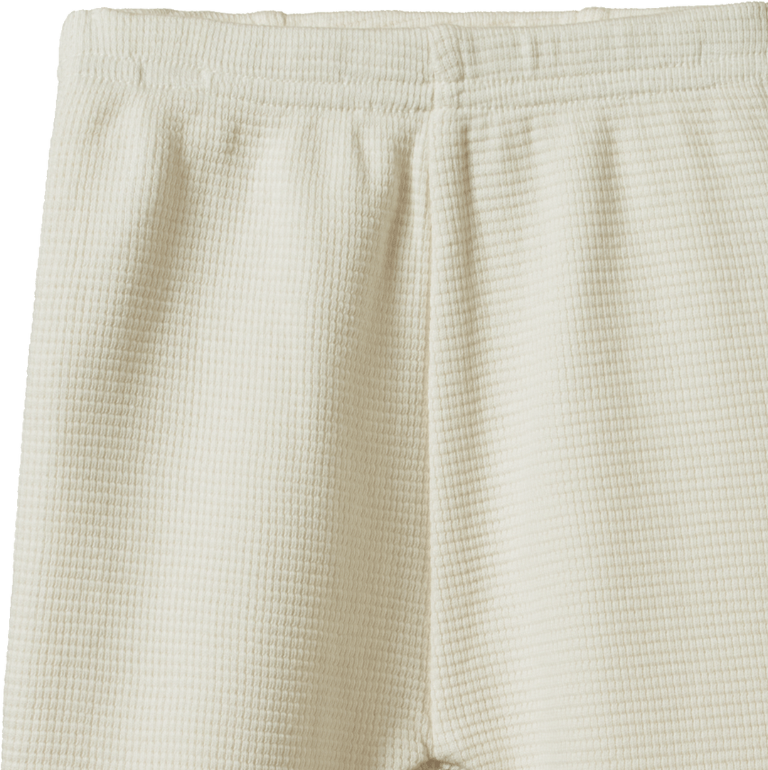 Détail de Pantalon pour bébé en coton gaufré naturel