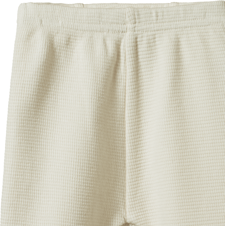 Détail de Pantalon pour bébé en coton gaufré naturel