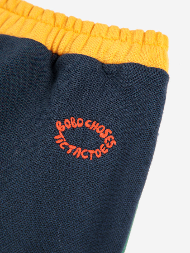 Détail de Pantalon jogging Bobo Choses en coton bleu avec détails jaune et rouge