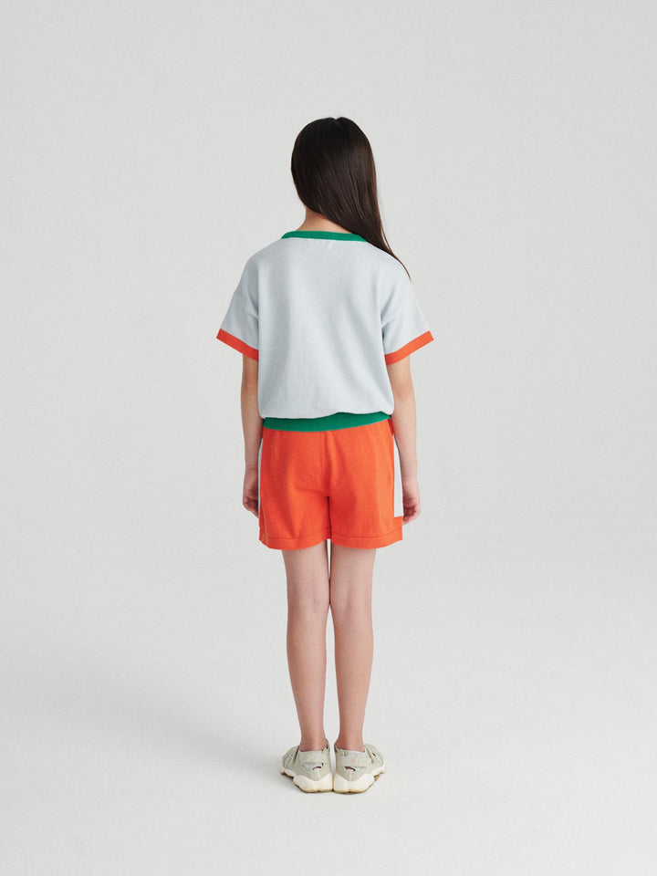 Fille avec Shorts True Artist tricotés en coton orage avec poches bleu pâle