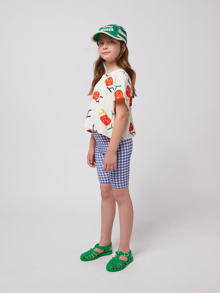 Fille avec T-shirt en coton blanc avec imprimés joy 