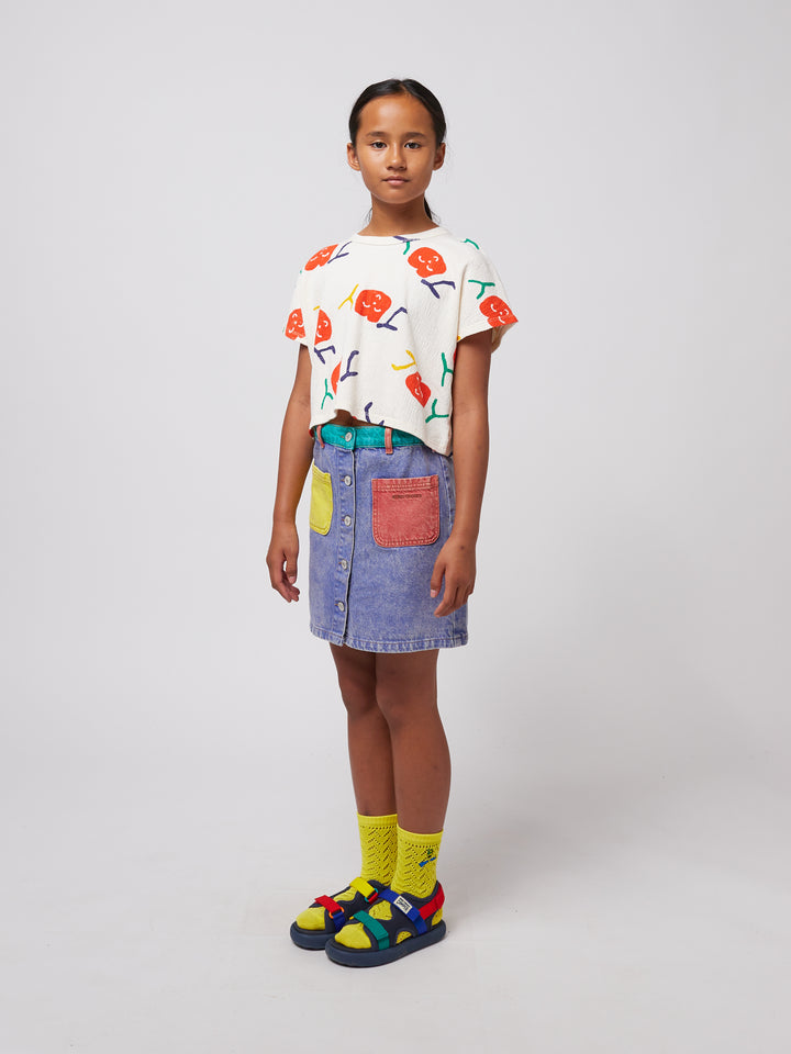 Fille avec T-shirt en coton blanc avec imprimés joy 