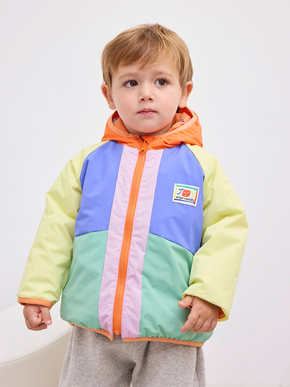 Enfant avec Veste réversible pour bébé en 100% Polyamide recyclé jaune, bleu vert, orange