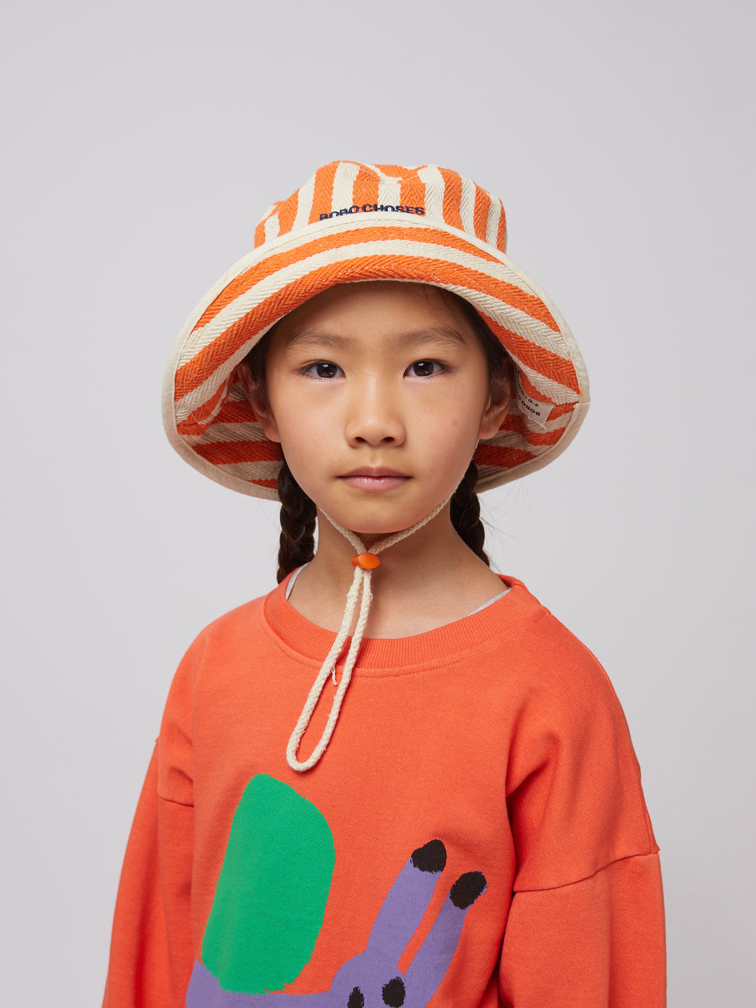 Fille avec Chapeau pêcheur en coton blanc et orange