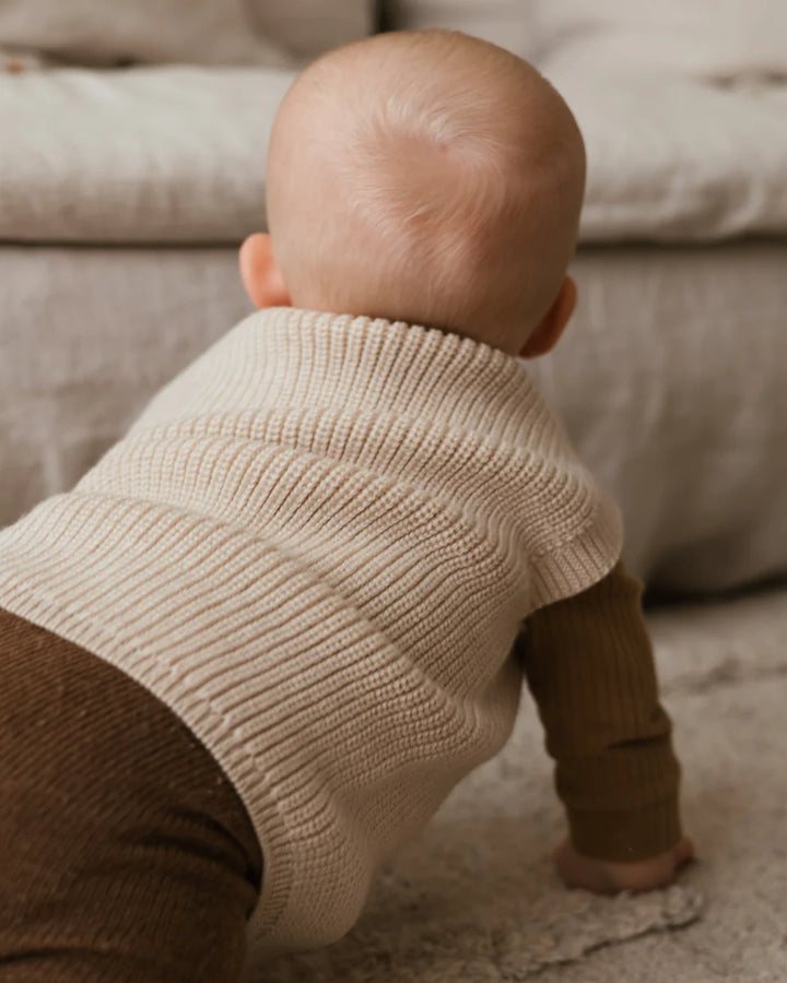 Bébé avec veste en laine mérinos crème 