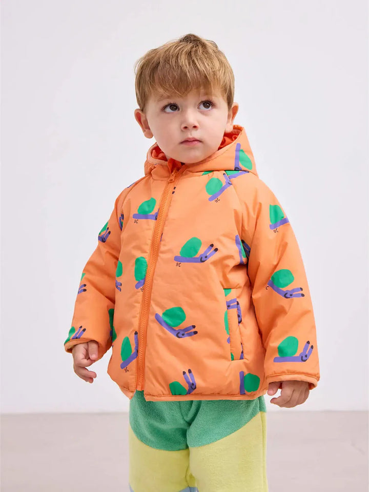 Enfant avec Veste réversible pour bébé en 100% Polyamide recyclé orange avec imprimé escargots 